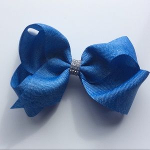 Large denim boutique hair bow on an alligator clip